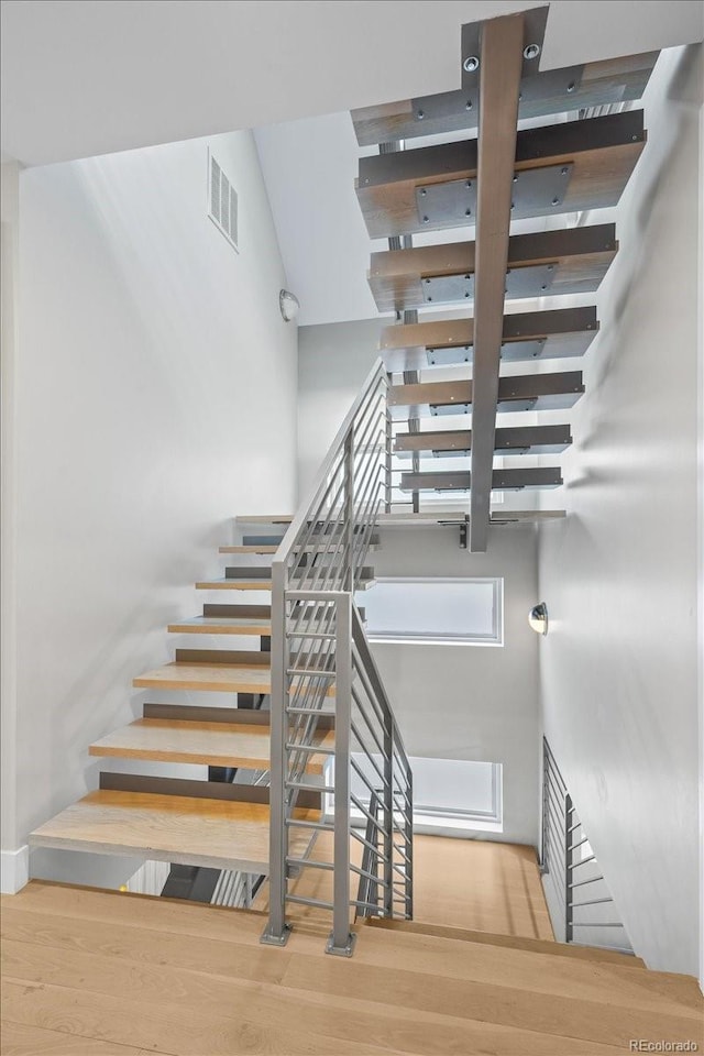 stairway featuring hardwood / wood-style floors