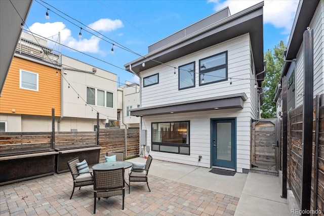 back of house featuring a patio