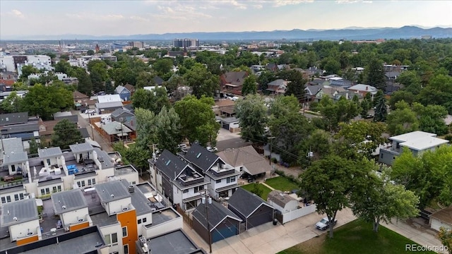 birds eye view of property with a mountain view