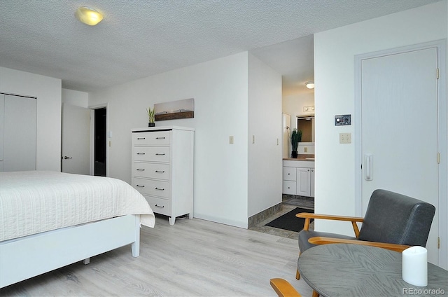 30600 County Road 371, Buena Vista, CO 81211 - bedroom featuring light wood-style floors and a textured ceiling