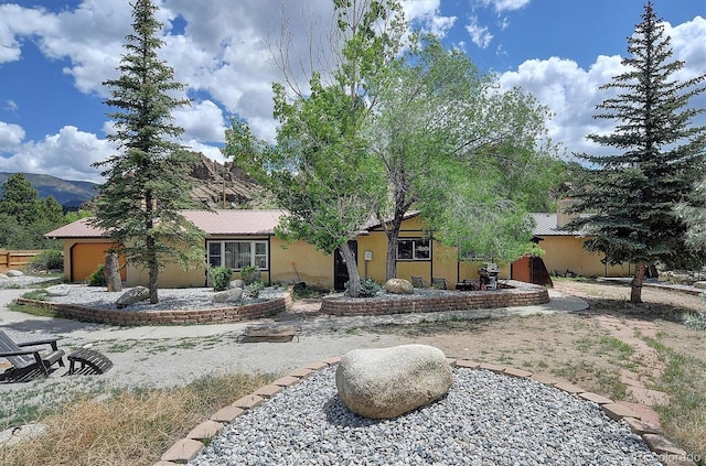 30600 County Road 371, Buena Vista, CO 81211 - view of front of home with a garage and stucco siding
