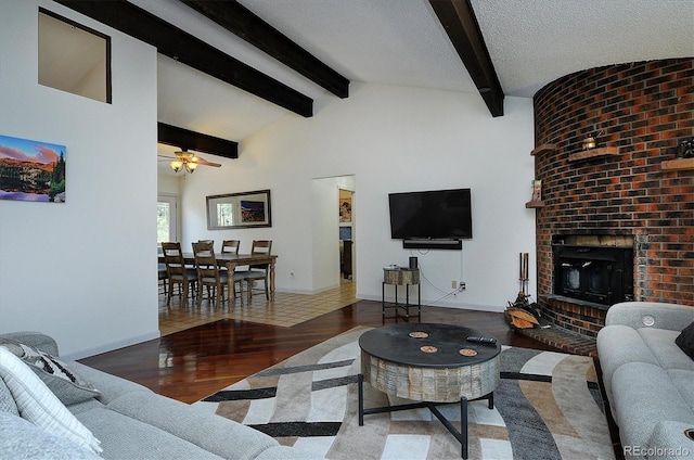 30600 County Road 371, Buena Vista, CO 81211 - living area featuring wood finished floors, a ceiling fan, and a fireplace
