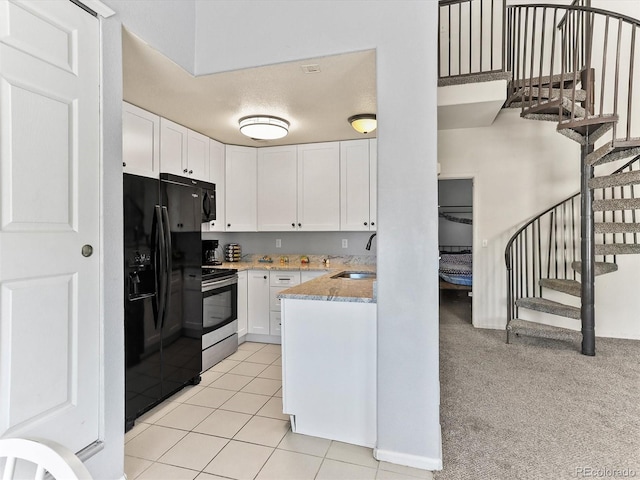 8361 S Upham Way Unit 209, Littleton, CO 80128 - kitchen with black refrigerator with ice dispenser, stainless steel range with electric cooktop, light stone counters, white cabinetry, and a sink