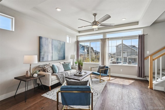 living area with a ceiling fan, recessed lighting, baseboards, stairs, and hardwood / wood-style floors
