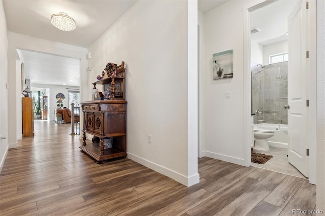 hallway featuring hardwood / wood-style floors