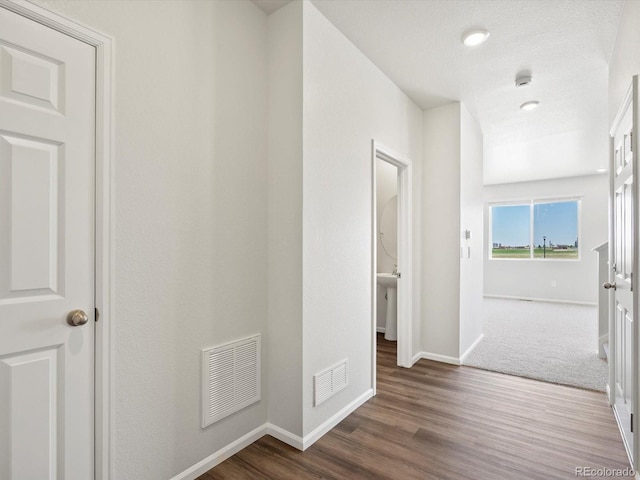 544 97th Ave, Greeley, CO 80634 - hallway featuring baseboards and wood finished floors