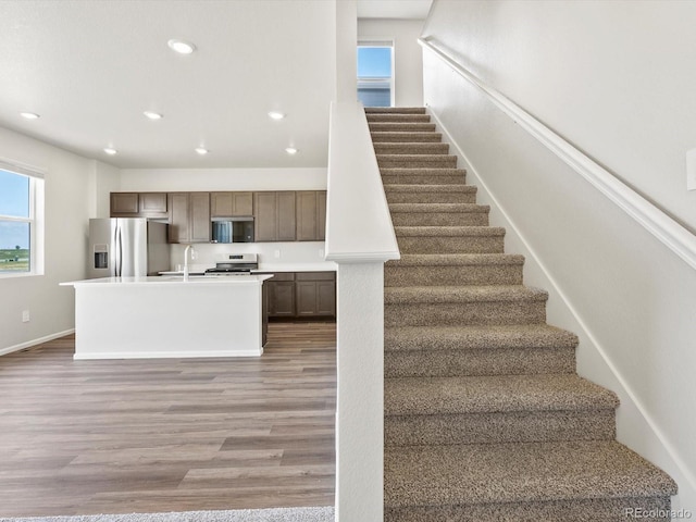 544 97th Ave, Greeley, CO 80634 - stairway with wood finished floors and recessed lighting