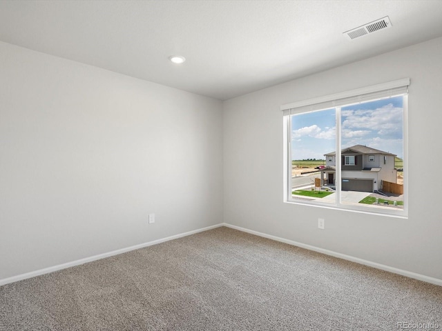 544 97th Ave, Greeley, CO 80634 - carpeted spare room featuring baseboards and recessed lighting