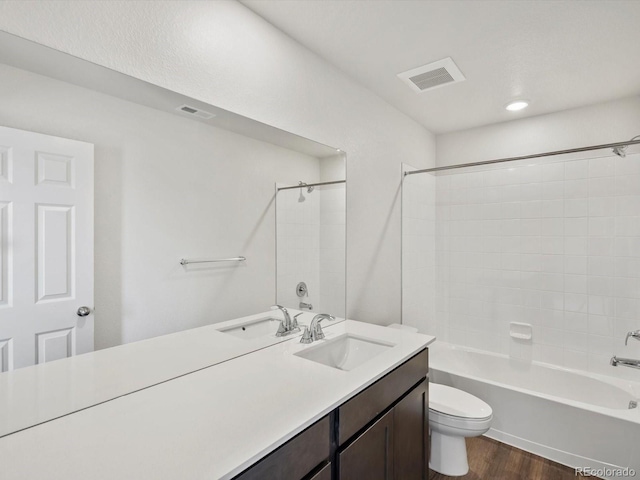 544 97th Ave, Greeley, CO 80634 - bathroom with vanity, tub / shower combination, and wood finished floors