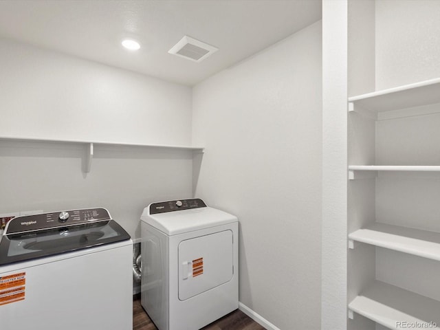 544 97th Ave, Greeley, CO 80634 - washroom featuring separate washer and dryer and dark wood-type flooring
