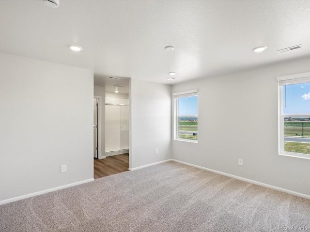 544 97th Ave, Greeley, CO 80634 - carpeted spare room with recessed lighting and a smoke detector