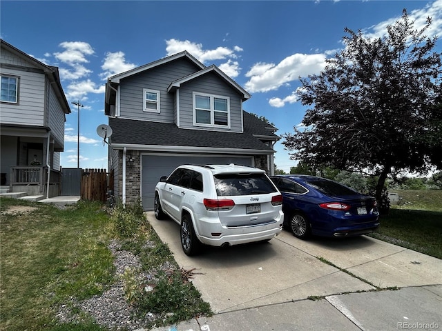 2005 W 86th Ave, Denver, CO 80260 - view of front of home featuring driveway, a garage, and a shingled roof