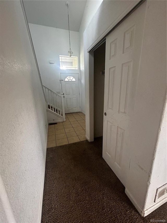 2005 W 86th Ave, Denver, CO 80260 - hallway featuring carpet floors and tile patterned flooring