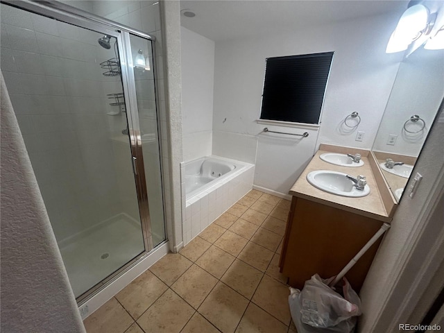2005 W 86th Ave, Denver, CO 80260 - full bathroom with tile patterned flooring, a stall shower, double vanity, and a garden tub