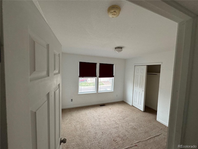 2005 W 86th Ave, Denver, CO 80260 - unfurnished bedroom featuring carpet floors and a closet