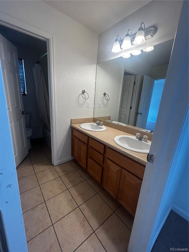 2005 W 86th Ave, Denver, CO 80260 - bathroom featuring double vanity, tile patterned flooring, and a shower with curtain