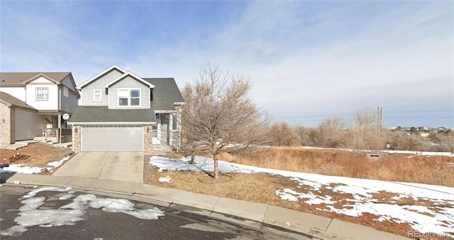 2005 W 86th Ave, Denver, CO 80260 - view of front of house with concrete driveway, a garage, and stone siding