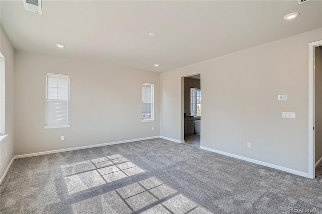 unfurnished room with carpet floors