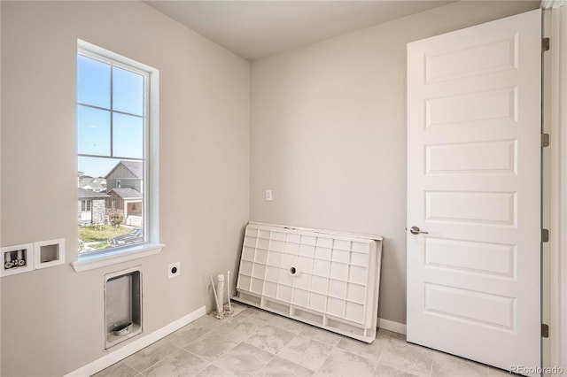 spare room featuring baseboards