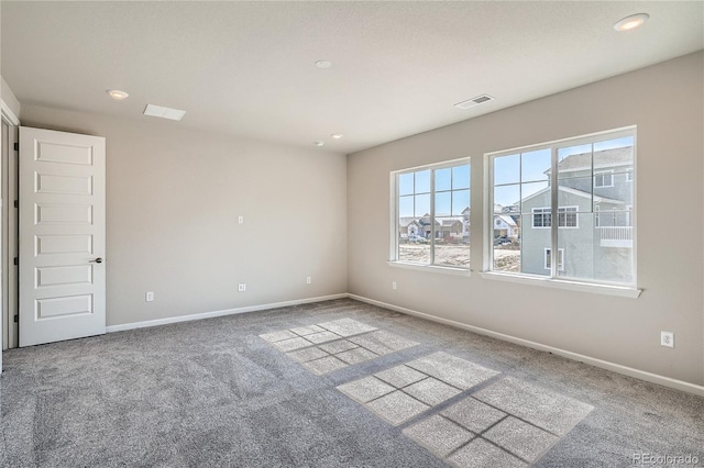 empty room featuring recessed lighting, visible vents, carpet flooring, and baseboards