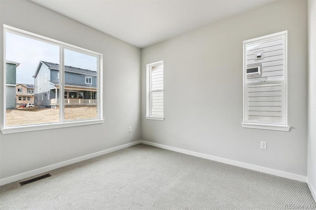 2560 Wesley Ln, Lafayette, CO 80026 - carpeted spare room with baseboards and visible vents