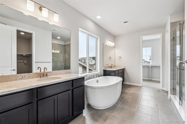 2560 Wesley Ln, Lafayette, CO 80026 - full bath featuring a sink, a shower stall, and a healthy amount of sunlight
