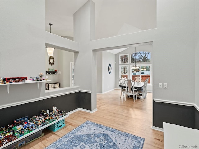 5497 W Prentice Ct, Littleton, CO 80123 - interior space featuring light wood-style floors and a towering ceiling