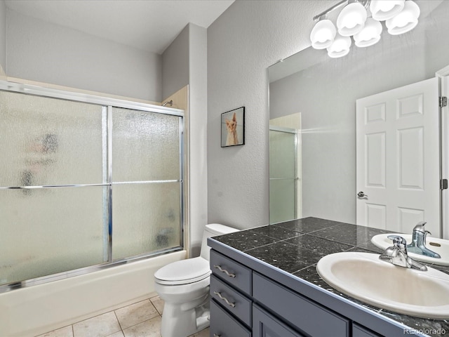 5497 W Prentice Ct, Littleton, CO 80123 - full bathroom with a chandelier, vanity, a textured wall, combined bath / shower with glass door, and tile patterned flooring