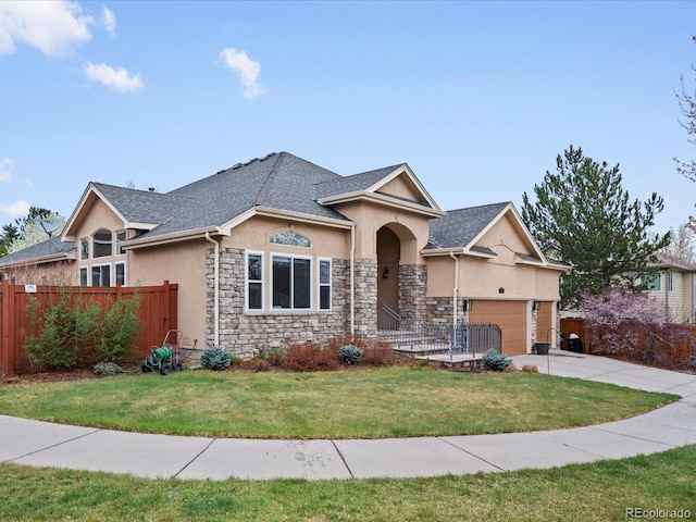 5497 W Prentice Ct, Littleton, CO 80123 - traditional home with stucco siding, a garage, driveway, and stone siding