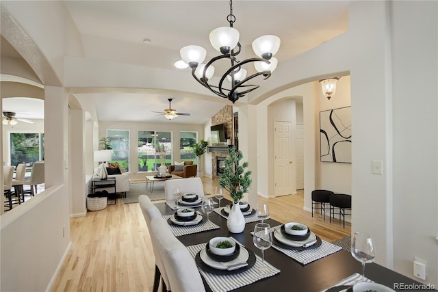 2840 Canyon Crest Ln, Highlands Ranch, CO 80126 - dining space featuring arched walkways, ceiling fan, and healthy amount of natural light