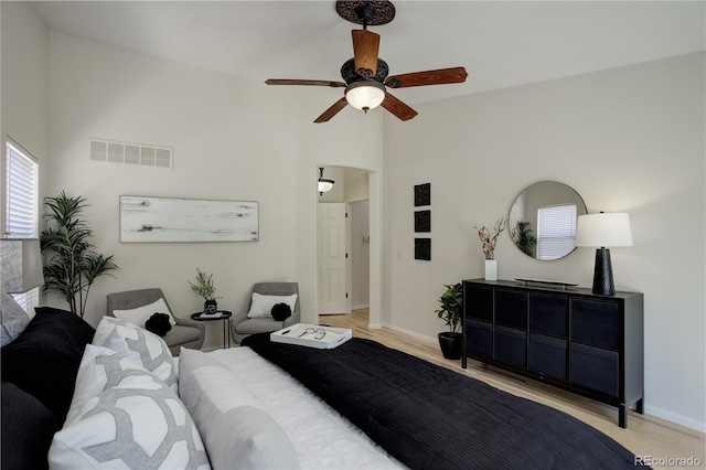 2840 Canyon Crest Ln, Highlands Ranch, CO 80126 - bedroom featuring light wood-type flooring, baseboards, high vaulted ceiling, and ceiling fan