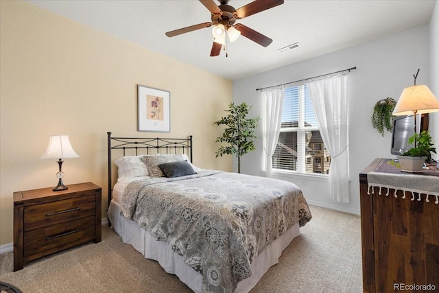 5378 Palomino Ranch Pt Unit 303, Colorado Springs, CO 80922 - bedroom featuring light colored carpet, ceiling fan, visible vents, and baseboards