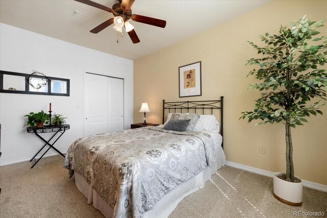 5378 Palomino Ranch Pt Unit 303, Colorado Springs, CO 80922 - bedroom featuring a closet, light carpet, ceiling fan, and baseboards