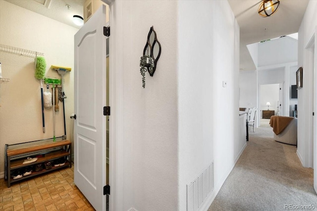 5378 Palomino Ranch Pt Unit 303, Colorado Springs, CO 80922 - hall featuring brick floor and visible vents
