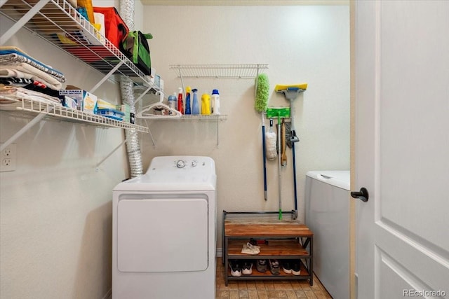 5378 Palomino Ranch Pt Unit 303, Colorado Springs, CO 80922 - laundry room with washer and dryer and laundry area
