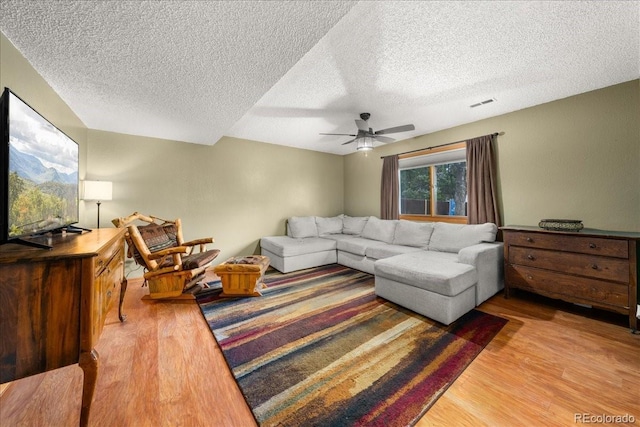 1345 2nd Street Rd, Eaton, CO 80615 - living room featuring a ceiling fan, a textured ceiling, visible vents, and wood finished floors