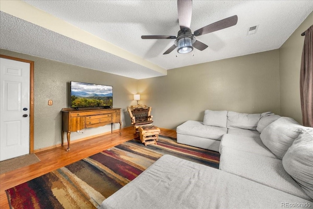 1345 2nd Street Rd, Eaton, CO 80615 - living room featuring ceiling fan, a textured ceiling, visible vents, and wood finished floors