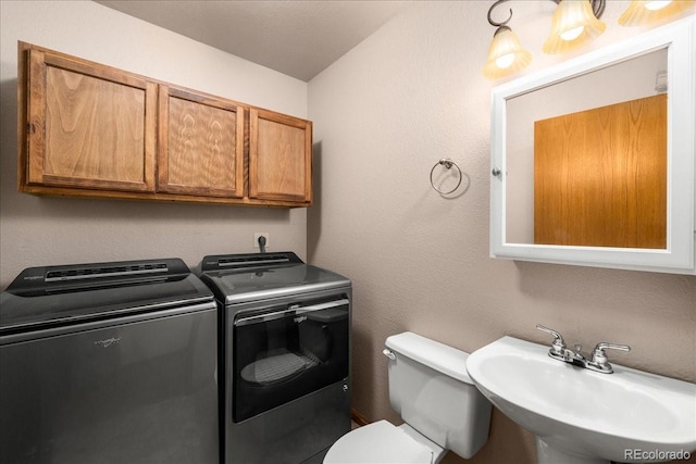 1345 2nd Street Rd, Eaton, CO 80615 - half bathroom with a sink, toilet, and washer and clothes dryer