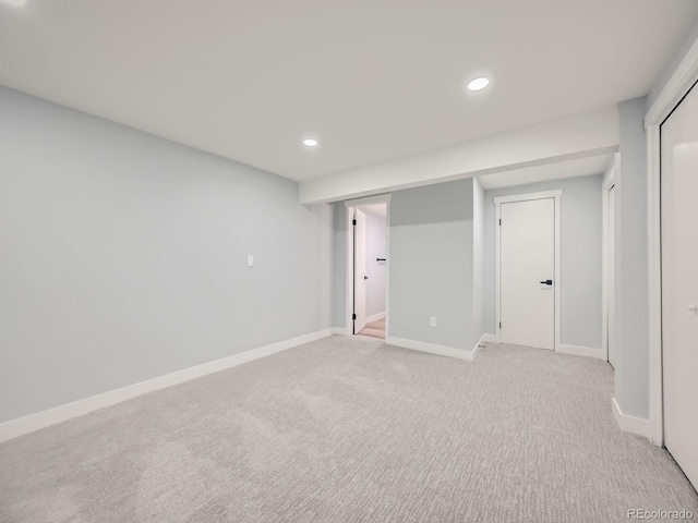 basement with light colored carpet