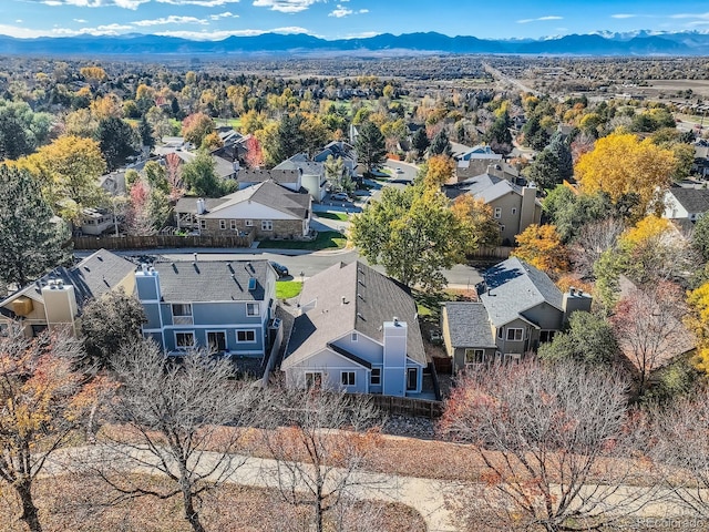 birds eye view of property with a mountain view