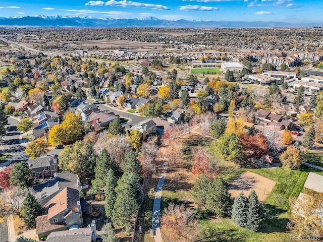 birds eye view of property with a mountain view