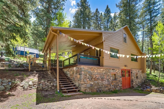 7364 Rossman Gulch Rd, Morrison, CO 80465 - view of front of property featuring stone siding and stairway