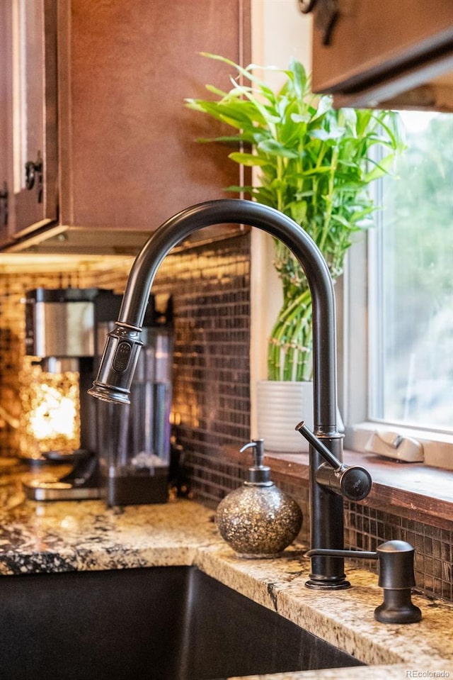 details with light stone counters and a sink