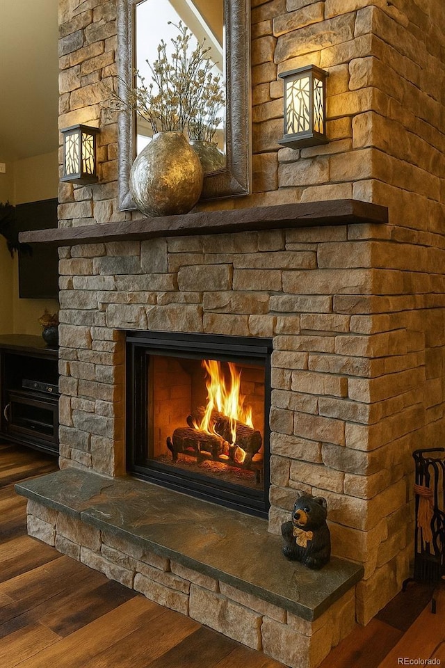 details with wood finished floors and a fireplace