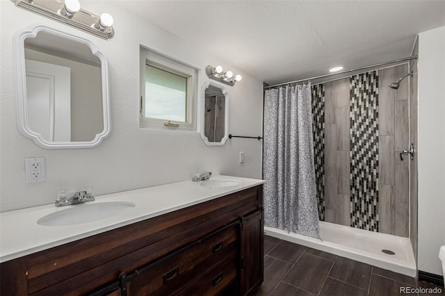299 4th Ave, Limon, CO 80828 - full bathroom with a stall shower, double vanity, and recessed lighting