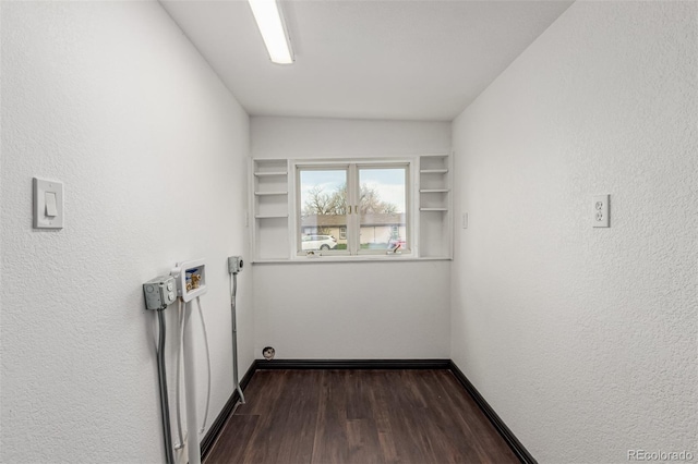 299 4th Ave, Limon, CO 80828 - washroom featuring dark wood finished floors, washer hookup, baseboards, and a textured wall