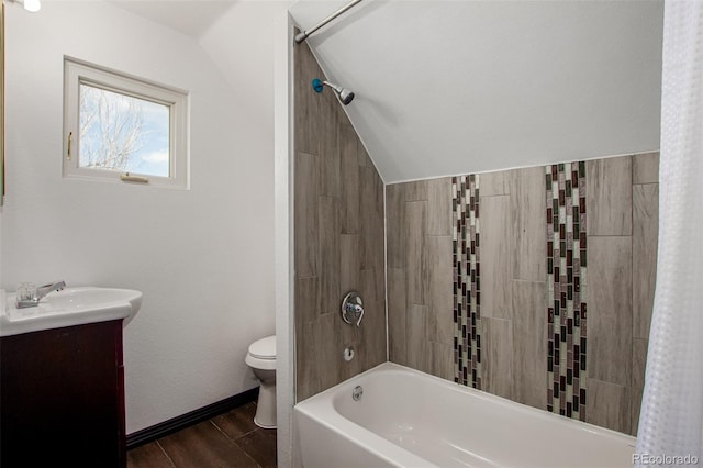 299 4th Ave, Limon, CO 80828 - full bathroom with toilet, wood finished floors, shower / washtub combination, vanity, and lofted ceiling