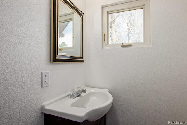 299 4th Ave, Limon, CO 80828 - bathroom with vanity and a textured wall