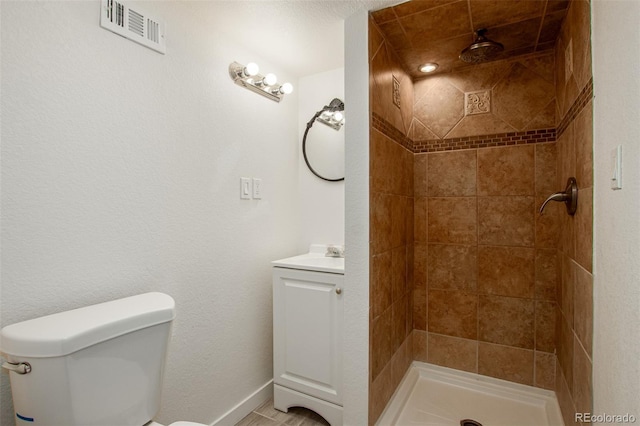 299 4th Ave, Limon, CO 80828 - bathroom featuring toilet, a shower stall, and baseboards