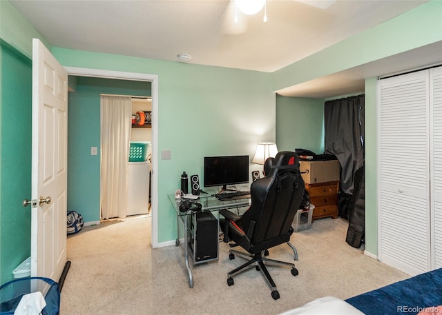 office space featuring baseboards, a ceiling fan, and carpet floors